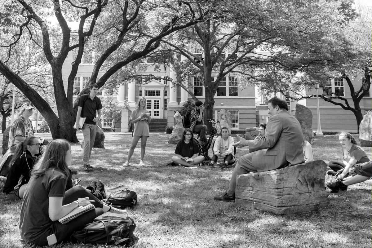 professor and students in an outdoor class