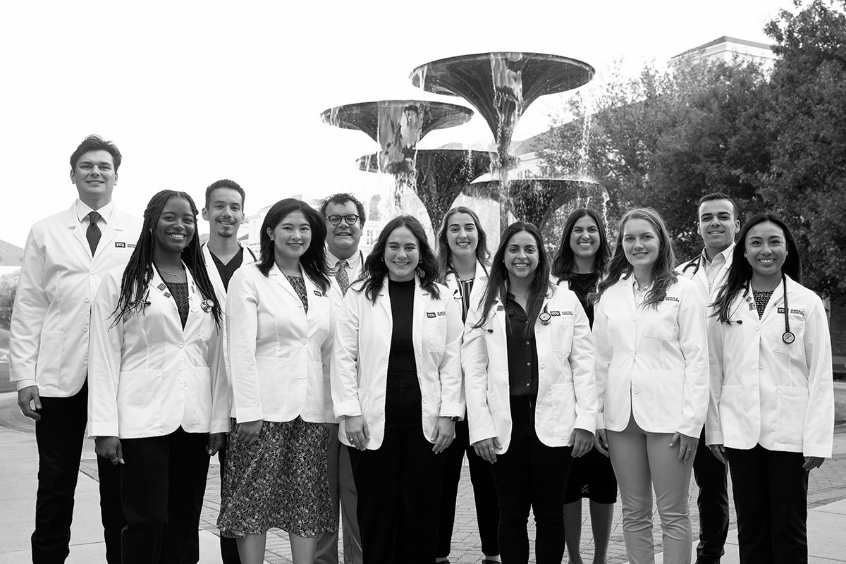 TCU medical students gather in front of Frog Fountain